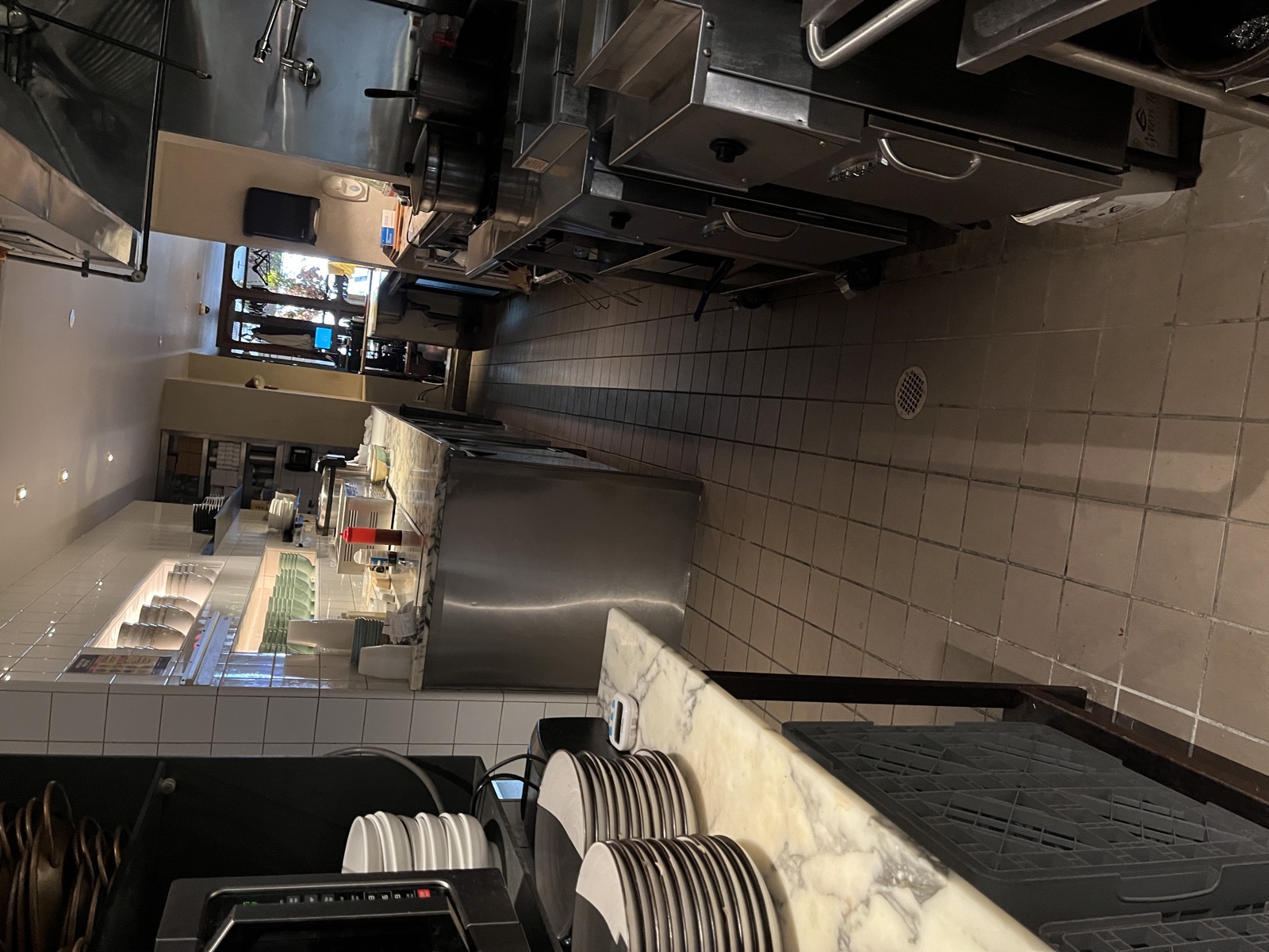 Spotless commercial restaurant kitchen line and tile floor